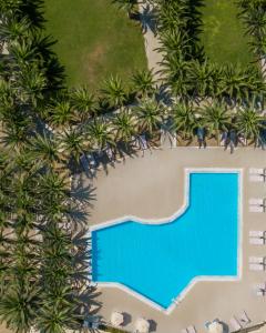 an overhead view of the pool at the resort at Aphrodite Hotel in Mythimna