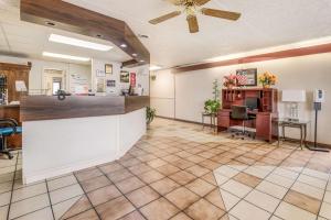 a lobby with a bar in the middle of a room at Econo Lodge Eden in Eden