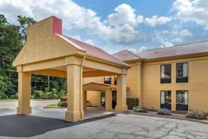 a large office building with a covered parking lot at Econo Lodge in Saint Stephen