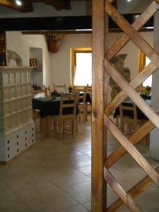a kitchen and dining room with a table and chairs at La Tieda - locazione turistica Reolon in Belluno