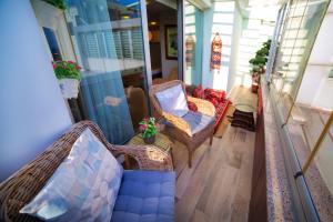 a porch with a hammock and chairs on a house at Zagreb Hotel in Istanbul