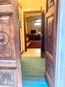 an open door to a room with a living room at Monolocale in Perugia