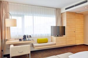 TV a/nebo společenská místnost v ubytování H+ Hotel Salzburg