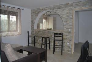 a living room with a table and chairs and a mirror at Apartments Aneta in Ulcinj