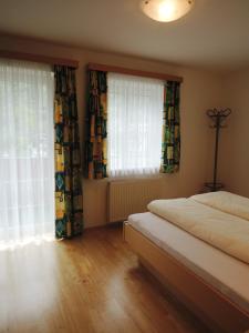 Кровать или кровати в номере Appartements Edda