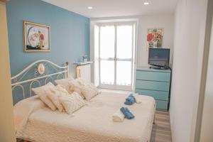 Posteľ alebo postele v izbe v ubytovaní Casa AZZURRA 61Mq a 30 metri dalla Reggia di Venaria + 36 fotografií