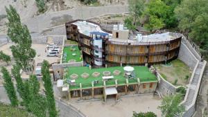 an aerial view of a building with a green roof at Famree Resort Hunza in Hunza