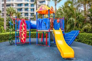 a colorful playground with a slide and a slideintend at Chevron Renaissance 2 Bed Apartment by Vaun in Gold Coast