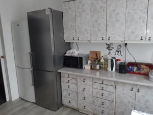 Kuchyňa alebo kuchynka v ubytovaní Bon Voyage Apartments