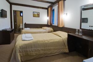 Postel nebo postele na pokoji v ubytování Complex Balgarka + 12 fotografií