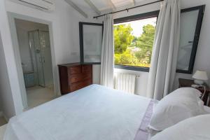Posteľ alebo postele v izbe v ubytovaní Bonita stay B Light Piscina climatizada, bbq, wifi