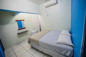 Hotel Cielo tesisinde bir odada yatak veya yataklar
