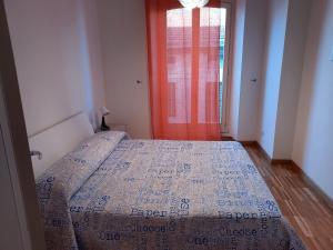 Ένα ή περισσότερα κρεβάτια σε δωμάτιο στο Casa Vacanze Borgo Marinaro
