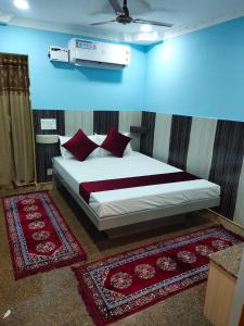 Ένα ή περισσότερα κρεβάτια σε δωμάτιο στο Chakravarthy Holidays