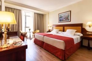 Posteľ alebo postele v izbe v ubytovaní Gran Hotel de Ferrol