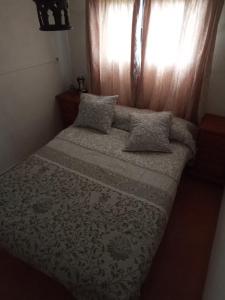 A bed or beds in a room at Castillo Esmeralda