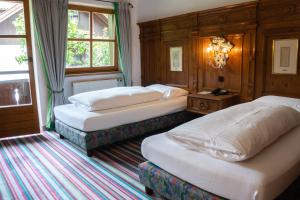Postel nebo postele na pokoji v ubytování Hotel Schrenkhof