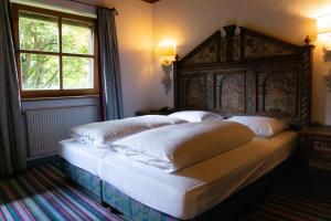Postel nebo postele na pokoji v ubytování Hotel Schrenkhof