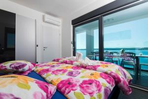 Postel nebo postele na pokoji v ubytování Design-Beachresort + 37 fotografií