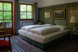 Postel nebo postele na pokoji v ubytování Hotel Schrenkhof