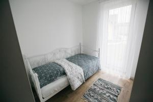Posteľ alebo postele v izbe v ubytovaní Apartamenty Perła Orawy