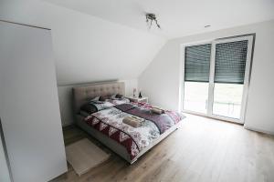 Posteľ alebo postele v izbe v ubytovaní Apartamenty Perła Orawy