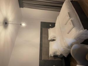 Ένα ή περισσότερα κρεβάτια σε δωμάτιο στο Hotel SH & SH