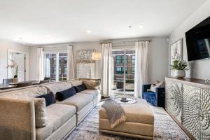 a living room with a couch and a tv at The Port in New Orleans