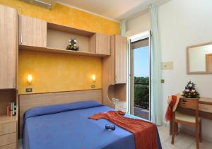 Säng eller sängar i ett rum på Hotel Ausonia