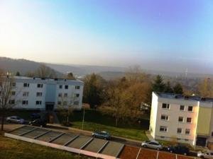 an aerial view of a building and a parking lot at Ferienwohnung Fernblick in Saarbrücken