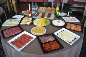 a table with many different types of food on it at Felipe IV in Valladolid