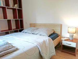 A bed or beds in a room at L'écrin du quercy