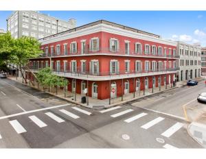 a red building on the corner of a street at The Sazerac in New Orleans