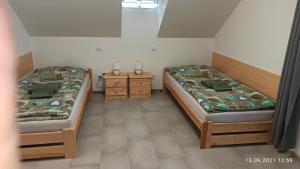Säng eller sängar i ett rum på Penzion Forest 2