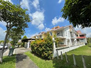 a house with a fence in front of it at 3R D'Latania Senawang in Seremban