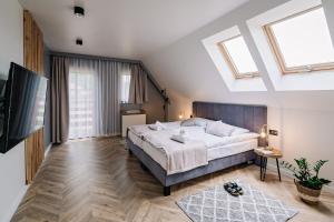 Posteľ alebo postele v izbe v ubytovaní APARTAMENTY NOVA BIAŁKA