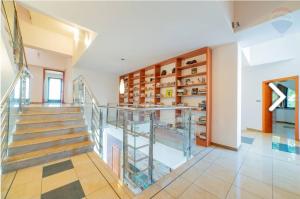 a staircase in a home with a glass shelf at Raca Retreat in Rača