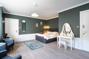 Postel nebo postele na pokoji v ubytování The Rose Suites