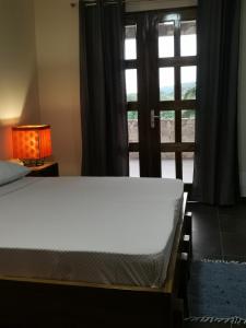 
A bed or beds in a room at Hotel Parc Residence
