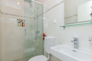 a bathroom with a shower and a toilet and a sink at Rooms Batina in Dubrovnik