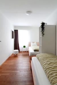 Postel nebo postele na pokoji v ubytování Bright and modern apartment in the heart of Altstätten