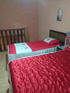 En eller flere senge i et værelse på Casa com piscina e churrasqueira
