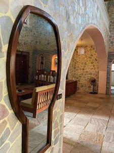 a mirror on a wall in a room at Villa San Miguel in Ouidah