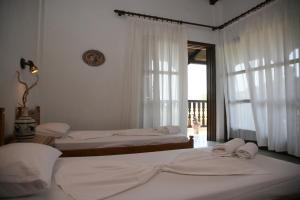 Cama ou camas em um quarto em Villa Frideriki