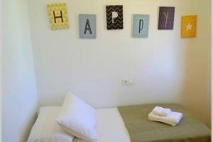 A bed or beds in a room at Casa Makis