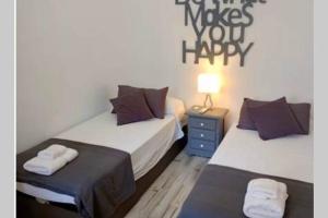 A bed or beds in a room at Casa Makis