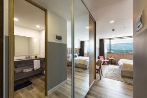 Letto o letti in una camera di Go Living and Suites - Jalo Rent