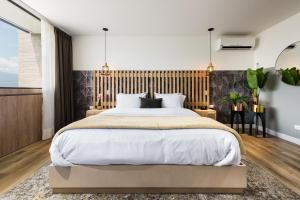 Letto o letti in una camera di Go Living and Suites - Jalo Rent