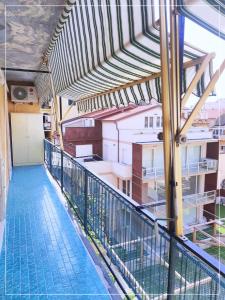 a balcony with a swimming pool on top of a building at La casa di Palma in Alassio