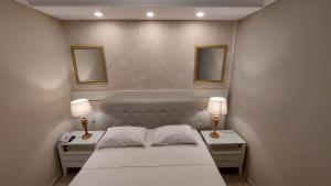 Säng eller sängar i ett rum på Ecos Hotel Tourist